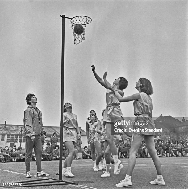 English athlete Ann Packer , a PE teacher at Coombe County Girls' School in New Malden, Surrey, watches her students playing netball, UK, 2nd...