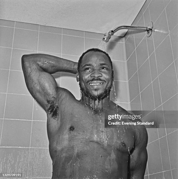 British middle-heavyweight weightlifter Louis Martin showering in London upon his return from the 1964 Summer Olympics in Tokyo, UK, 27th October...