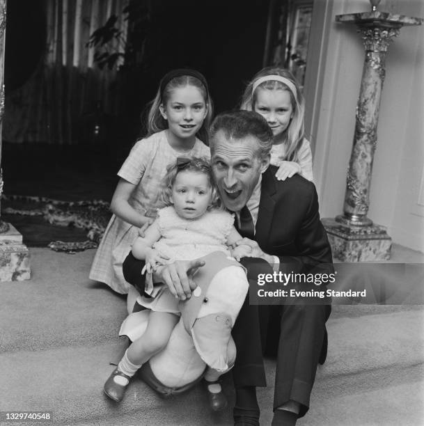 British entertainer and game show host Bruce Forsyth with his daughters Debbie, Julie and Laura at their home in Totteridge, London, UK, 24th...