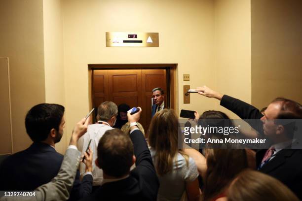 Sen. Mark Warner speaks to reporters in the Senate Subway on Capitol Hill on July 20, 2021 in Washington, DC. The Senate is expected to hold a...