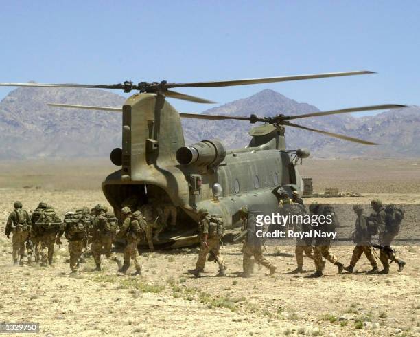 Royal Marines of 45 Commando board a Chinook helicopter of 27 Squadron RAF during Operation Condor May 20, 2002 in southeastern Afganistan.