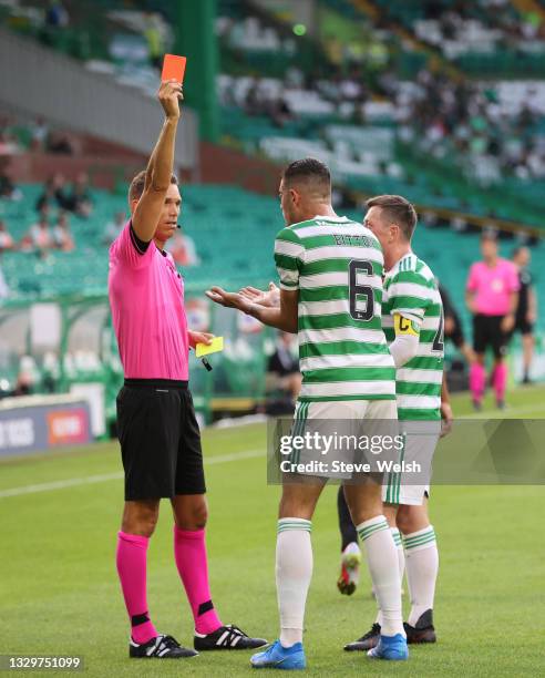 Nir Bitton of Celtic is shown a red card by Referee Sandro Scharer after clashing with Anders Dreyer of FC Midtylland during the UEFA Champions...