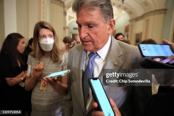 Sen. Joe Manchin talks to reporters as he leaves the the Senate Democrats weekly policy luncheon at the U.S. Capitol on July 20, 2021 in Washington,...