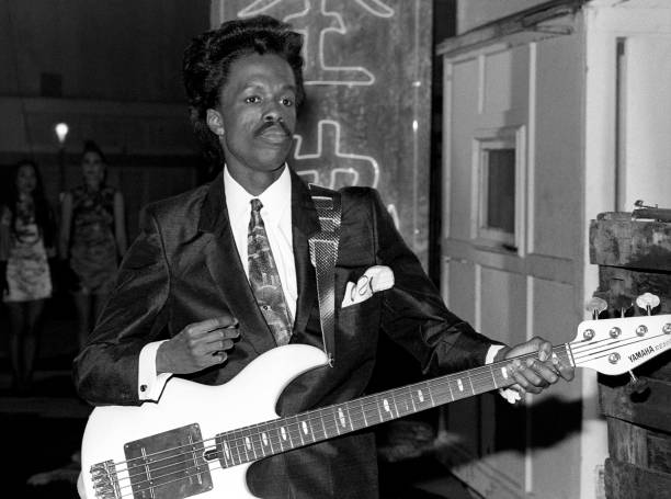 American bassist Verdine White, of the American band Earth, Wind & Fire, poses for a portrait with his guitar circa 1987 in Los Angeles, California.