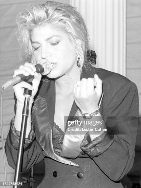 American singer, songwriter, and actress Taylor Dayne sings on stage on February 22, 1989 at the Arista Grammy party in Los Angeles, California.