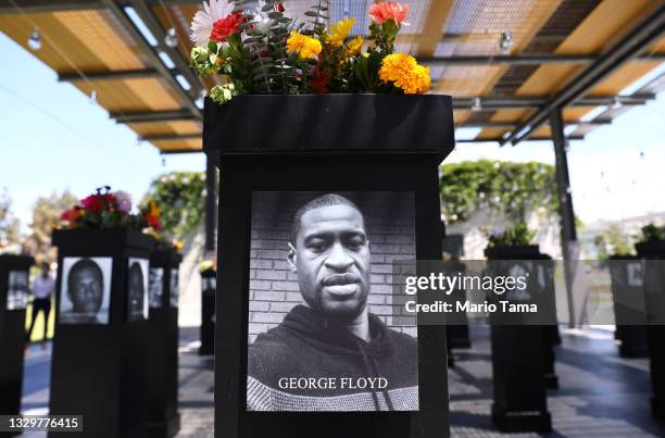 Photograph of George Floyd is displayed along with other photographs at the Say Their Names memorial exhibit at Martin Luther King Jr. Promenade on...