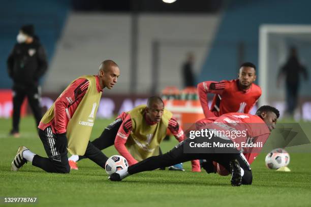 Joao Miranda Sao Paulo stretches with teammates before a round of sixteen second leg match between Racing Club and Sao Paulo as part of Copa CONMEBOL...