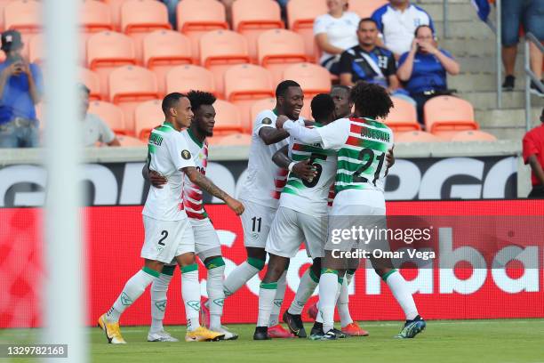 Nigel Hasselbaink of Suriname celebrates with his teammates after scoring 2nd goal during a group C match between Suriname and Guadeloupe as part of...