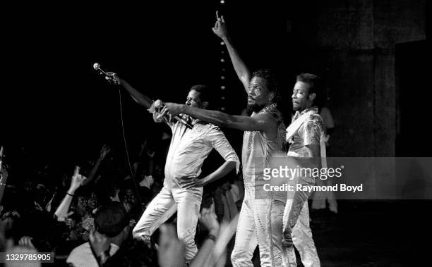 Musicians and singers Ronnie, Robert and Charlie Wilson of The Gap Band performs at the Arie Crown Theater in Chicago, Illinois in 1984.