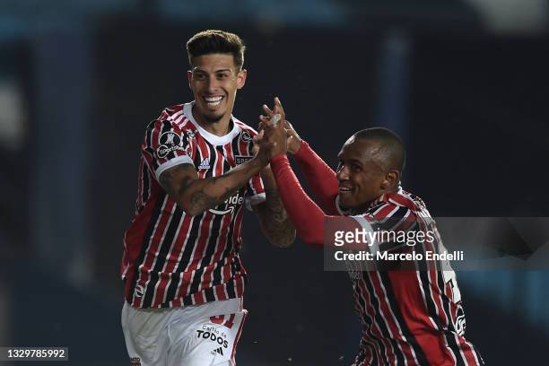 Emiliano Rigoni of Sao Paulo celebrates with Marquinhos of Sao Paulo after scoring the opening goal during a round of sixteen second leg match...
