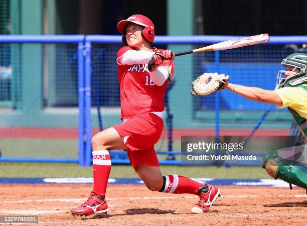 Yamato Fujita of Team Japan hits a two-run home run in the fourth inning against Team Australia during the Tokyo 2020 Olympic Games at Fukushima...