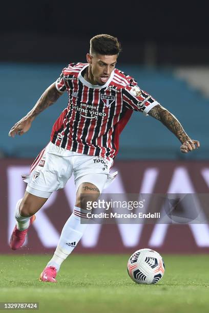 Emiliano Rigoni of Sao Paulo drives the ball during a round of sixteen second leg match between Racing Club and Sao Paulo as part of Copa CONMEBOL...