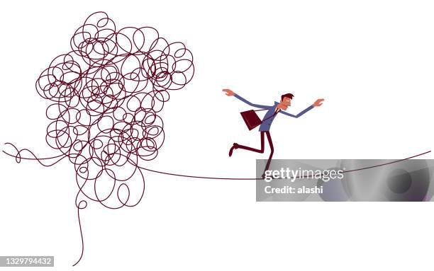 businessman escaping from a messily tangled tight rope. - escapism stock illustrations