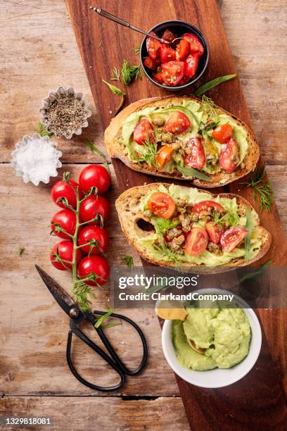 avocado toast with a tomato salsa topping. - dragon bildbanksfoton och bilder