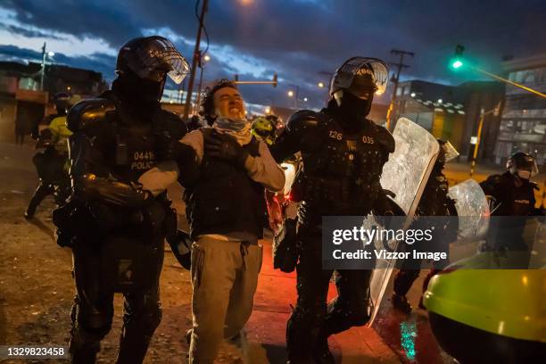 Front-line protester is arrested by the police in the Usme sector during the riots on July 20, 2021 in Bogota, Colombia. Delegates of the National...