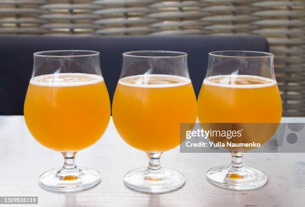 belgian beer in drinking glasses - belgian culture stock pictures, royalty-free photos & images