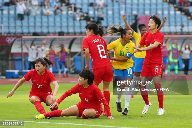 Marta of Team Brazil celebrates after scoring their side's first goal during the Women's First Round Group F match between China and Brazil during...