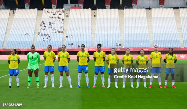 Players of Team Brazil stand for the national anthem prior to the Women's First Round Group F match between China and Brazil during the Tokyo 2020...