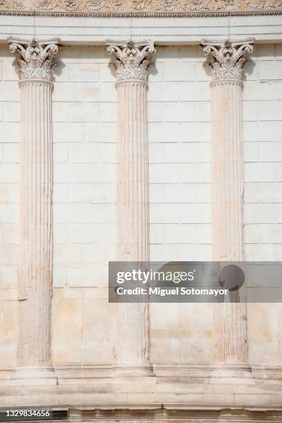 roman temple, the maison carrée - pillars stock pictures, royalty-free photos & images