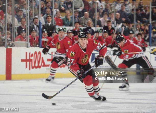 Jeremy Roenick, Left Wing for the Chicago Blackhawks in motion on the ice during the NHL Eastern Conference Northeast Division game against the...