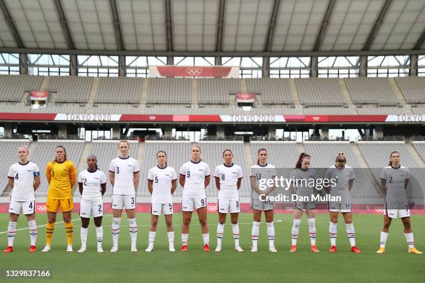 Players of Team United States stand for the national anthem prior to the Women's First Round Group G match between Sweden and United States during...