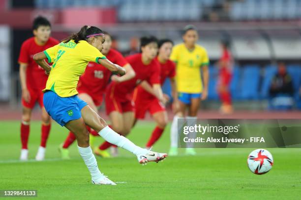 Andressa of Team Brazil scores their side's fourth goal from the penalty spot during the Women's First Round Group F match between China and Brazil...