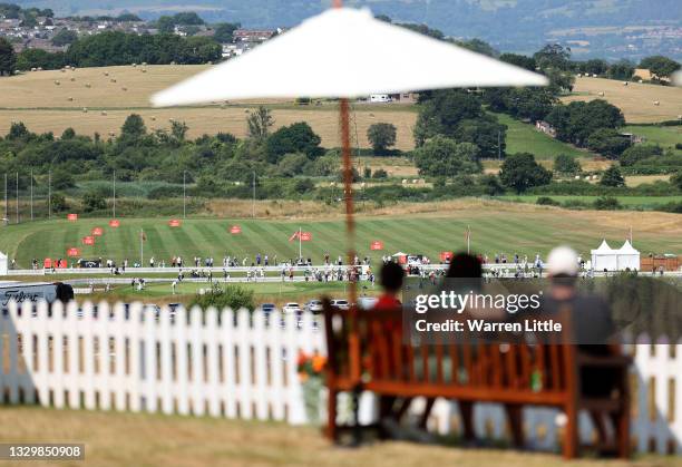 Spectators watch competitors practicing on the driving range ahead of the Cazoo Open supported by Gareth Bale at Celtic Manor Resort on July 21, 2021...