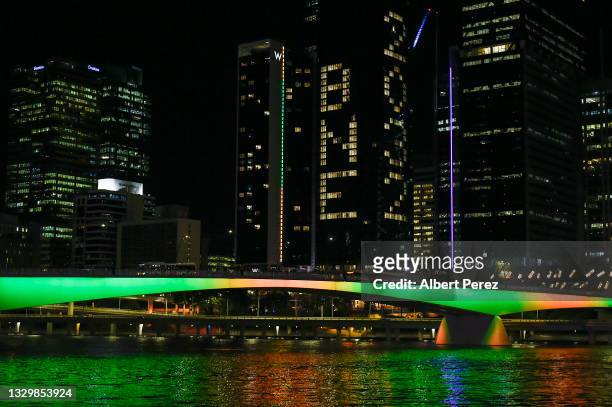 General view is seen as "BNE 2032" is displayed on a building during the announcement of the host city for the 2032 Olympic Games, watched via live...