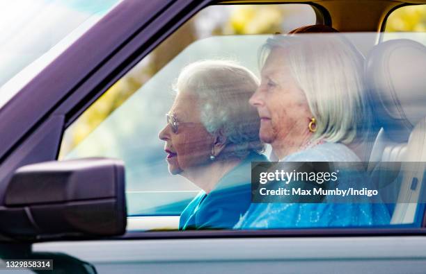 Queen Elizabeth II, accompanied by her lady-in-waiting Dame Annabel Whitehead, seen driving her Range Rover car as she attends day 1 of the Royal...