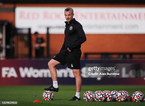 Kevin O'Connor, Assistant First Team Coach of Brentford looks on as players warm up prior to the Pre-Season Friendly match between Boreham Wood and...