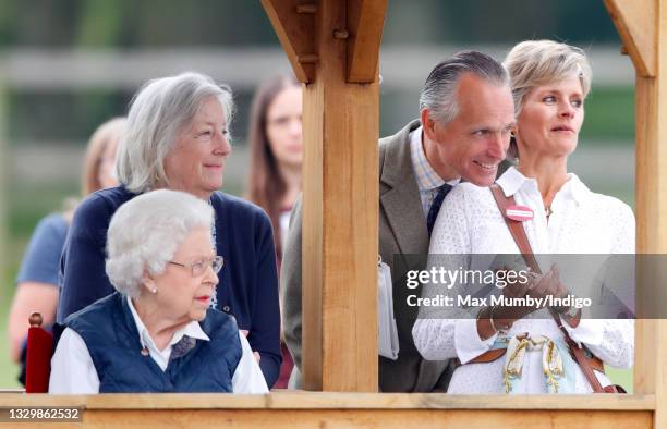 Queen Elizabeth II, accompanied by her lady-in-waiting Dame Annabel Whitehead , Rupert Ponsonby, Lord de Mauley and Lucinda Ponsonby, Lady de Mauley,...