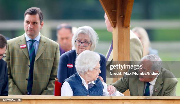 Queen Elizabeth II, accompanied by her equerry Lieutenant Colonel Tom White, her lady-in-waiting Dame Annabel Whitehead and her stud groom Terry...