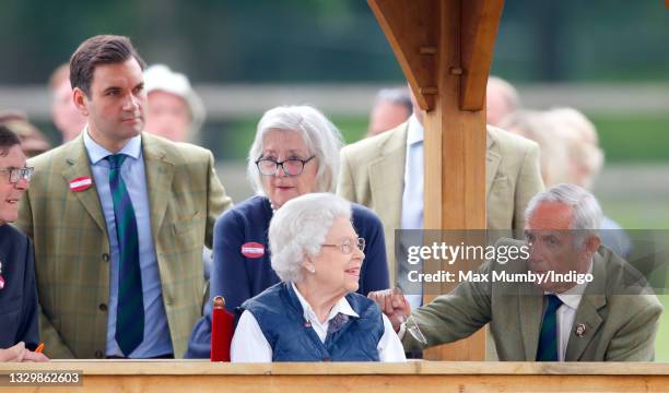 Queen Elizabeth II, accompanied by her equerry Lieutenant Colonel Tom White, her lady-in-waiting Dame Annabel Whitehead and her stud groom Terry...