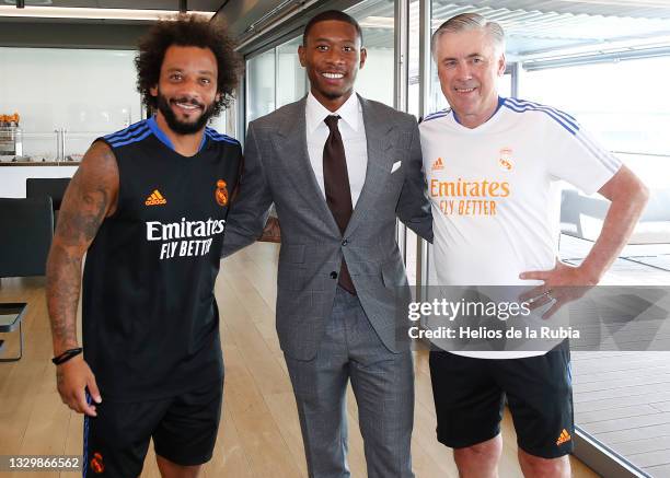 New signing David Alaba and Marcelo Silva both of Real Madrid with coach Carlo Ancelotti on July 21, 2021 in Madrid, Spain.