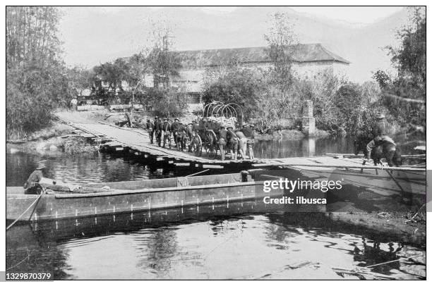 antique black and white photograph: american ammunition wagon crossing a stream on a pontoon bridge, philippines - ammunition magazine 幅插畫檔、美工圖案、卡通及圖標