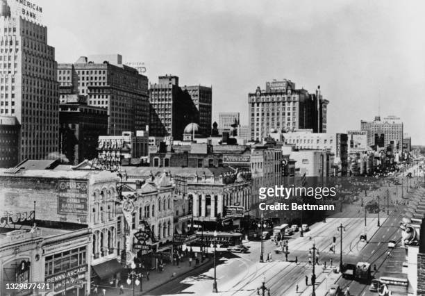 View looking west down Canal Street, with the National American Bank Building at 200 Carondalet at far left , New Orleans, Louisiana, USA, circa 1937.