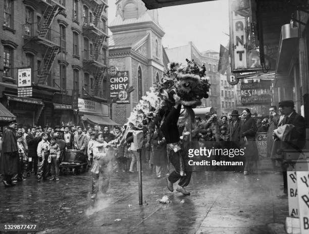 Dragon dance is performed in the snow on Mott Street during Chinese New Year celebrations in the Chinatown neighborhood of Lower Manhattan, New York...