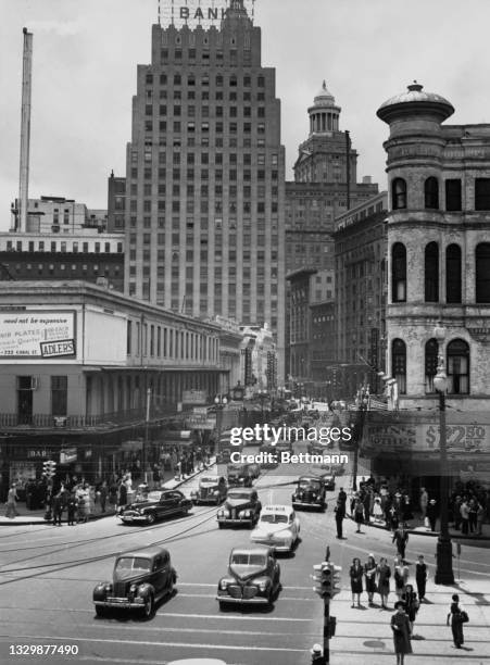 View across Canal Street and up Bourbon Street with the National American Bank Building at 200 Carondalet and the the Hibernia Bank Building in the...