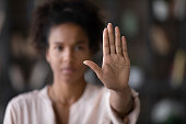 Close up African American woman showing stop gesture with hand