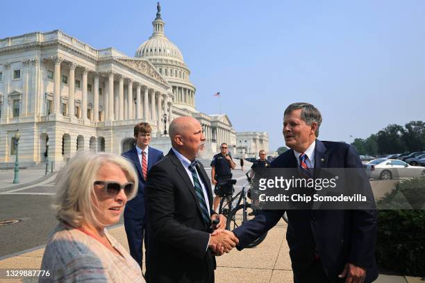 Sen. Steve Daines shakes hands with U.S. Rep. Chip Roy as Susan B. Anthony List Government Affairs Vice President Marilyn Musgrave looks on before a...