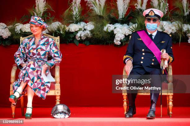 Princess Delphine and Prince Laurent of Belgium attend the ceremony in front of the Royal Palace on the occasion of the National Day on July 21, 2021...