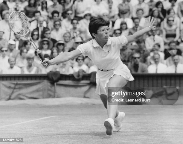 Billie Jean King of the United States plays a forehand return to Judy Tegart of Australia during their Women's Singles Final match at the Wimbledon...