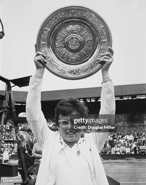 Billie Jean King of the United States holds the Venus Rosewater Dish aloft after defeating Ann Jones of Great Britain in their Women's Singles Final...