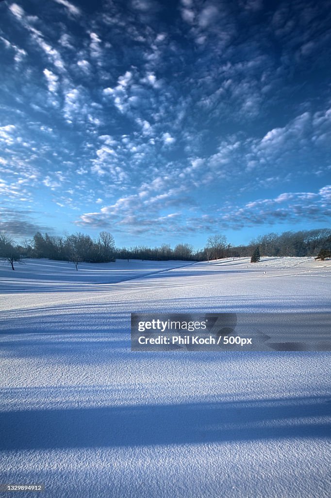 Scenic view of frozen lake against sky during winter,Wisconsin,United States,USA
