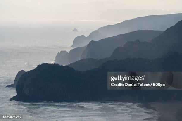 scenic view of sea and mountains against sky,new zealand - coastal feature stock pictures, royalty-free photos & images