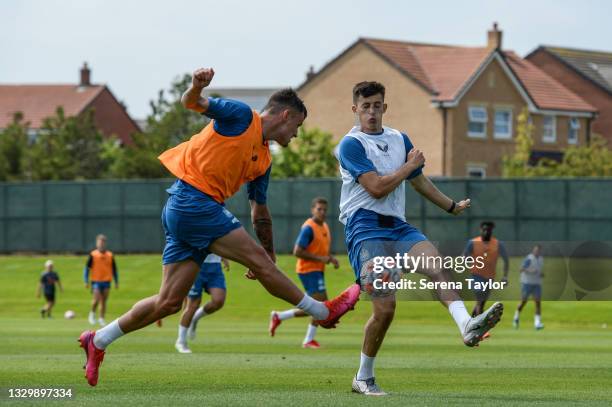 Kelland Watts blocks a cross from Tom Allan during the Newcastle United Pre Season Training session at the Newcastle United Training Centre on July...