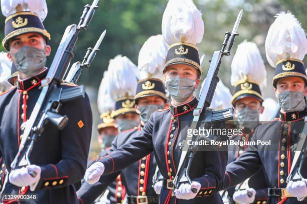 Princess Elisabeth of Belgium marches in the military parade of the Royal Military School during the ceremony in front of the Royal Palace on the...