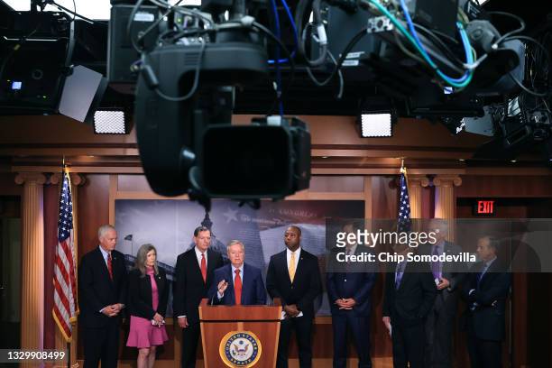 Sen. Lindsey Graham talks to reporters with Senate Minority Leader Mitch McConnell and other Senate Republicans during a news conference at the U.S....