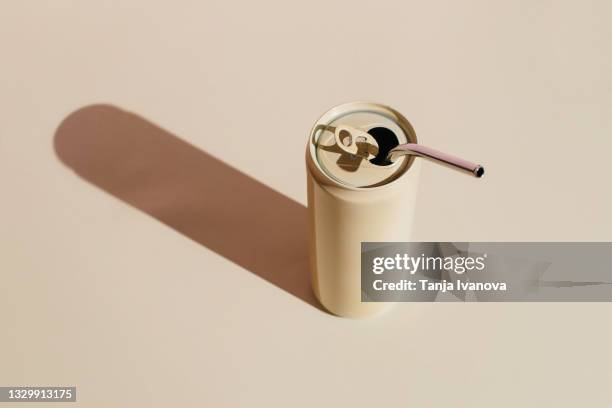 beige aluminum drink can with reusable stainless steel straws on beige background. minimal art still life. zero waste, plastic free concept. - drinks can stock pictures, royalty-free photos & images