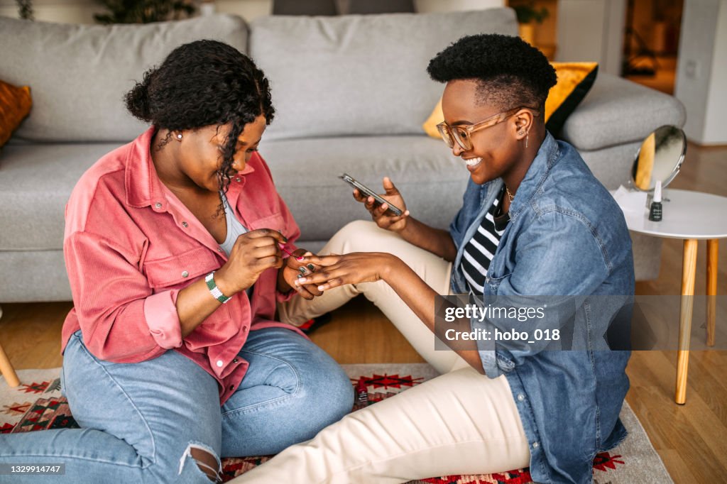 Nail polishing with friend at home